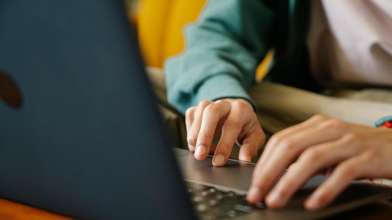 An individual typing on a laptop, focusing on the hands and keyboard in an indoor setting., tags: wirtschaftliche - pexel
